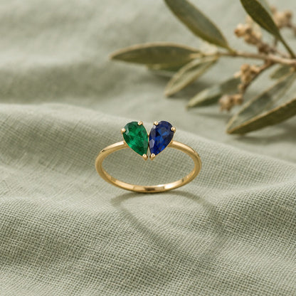 Bague deux pierres de naissance émeraude et saphir, or